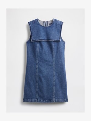 Traper haljina bez rukava, s velikim prednjim bibom i laganim A-linijom. Srednje plava boja s vidljivim šavovima.