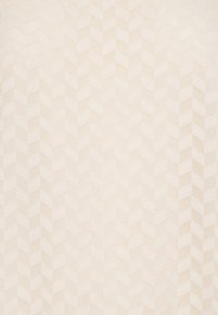 Textile with a light beige color featuring a raised zigzag pattern, creating texture and visual interest across the surface.