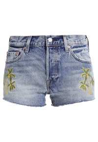 Ljusblå jeansshorts med palmer broderade i grönt och gult. Sliten fåll med klassisk femfickdesign.