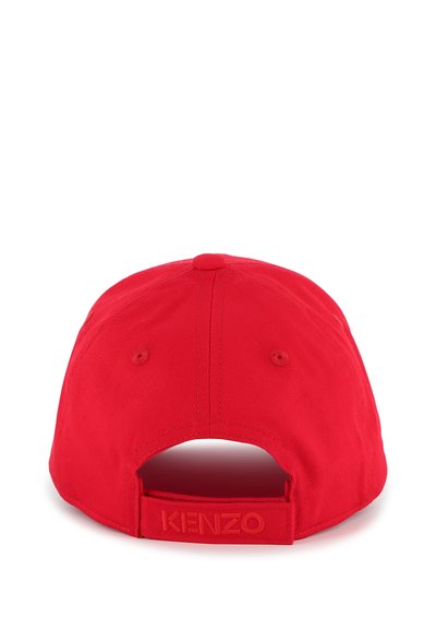 Red cotton cap with a curved brim, adjustable strap at the back, and "KENZO" logo embossed in matching red on the strap.