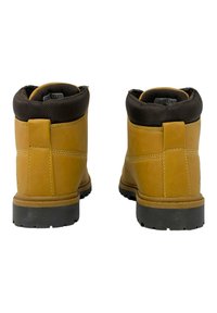 Brązowe skórzane botki za kostkę z fakturowanym czarnym kołnierzem, z solidną gumową podeszwą i pętlą z tyłu dla łatwego zakładania.