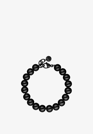 Black beaded bracelet with round beads, lobster clasp, and a small round tag attached near the clasp, arranged in a circular shape.