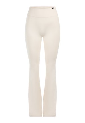 Legginsy w neutralnym odcieniu beżu, z wysokim stanem, dopasowanym krojem oraz gładkim, elastycznym materiałem bez widocznych wzorów.