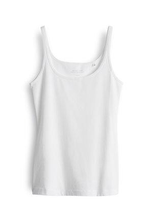 Débardeur blanc à fines bretelles, fabriqué en tissu de coton doux. Il présente un col rond et un ourlet droit sans embellissements.