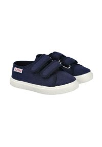 Zapatillas de lona navy con dos correas de velcro, parte superior texturizada, suela de goma blanca, puntera redonda y un pequeño parche con el logo en el lateral.