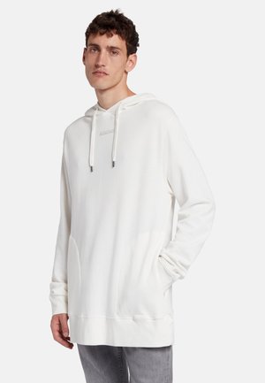 White hoodie with a drawstring hood, soft fabric, front kangaroo pocket, and subtle logo detailing on the chest. Long sleeves, relaxed fit.