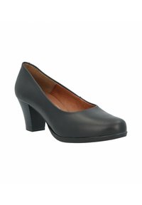 Zapato de tacón alto negro hecho de material sintético suave, con punta redondeada y un tacón texturizado para mayor estabilidad. El interior es marrón.