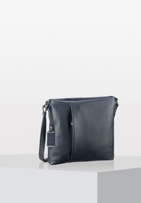 Dark navy leather shoulder bag with textured surface, a zipper closure, and an adjustable strap; includes a small tag attached.