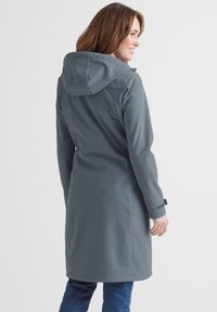 Water-resistant, lightweight gray raincoat with a hood, long sleeves, and a straight-cut design, featuring adjustable cuffs and a smooth texture.
