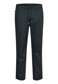 Pantalones de un oscuro color azul marino con cintura elástica, cordón ajustable y un corte relajado. El material parece ligero con una textura suave.