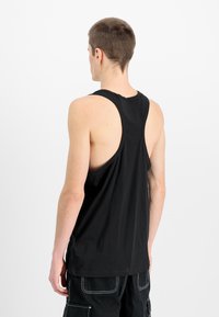 Black sleeveless tank top made of smooth fabric, featuring wide armholes and a relaxed fit, showing the back view.