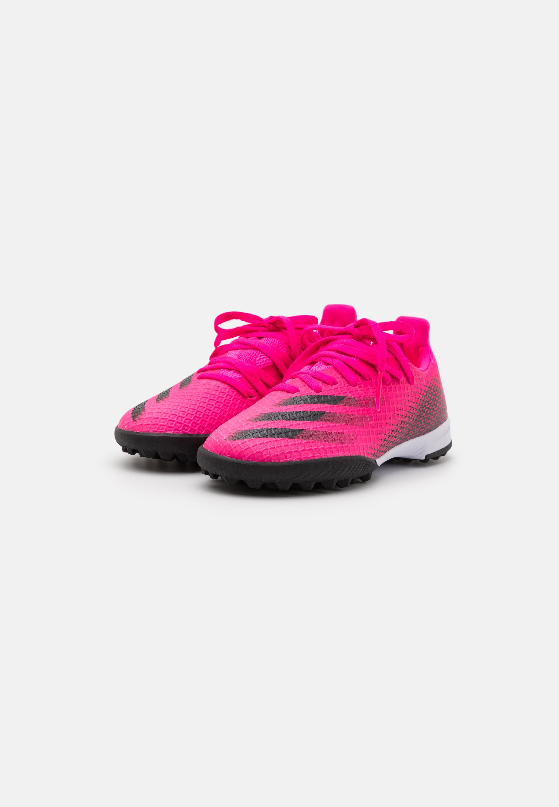 pink and blue adidas astro turf