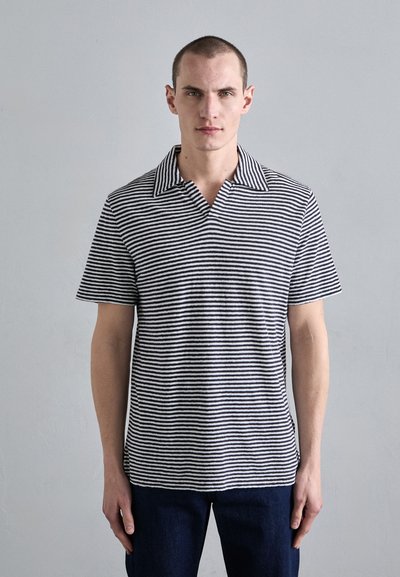 Striped polo shirt in black and white, featuring a wide collar and short sleeves. Material appears to be a soft, lightweight fabric.