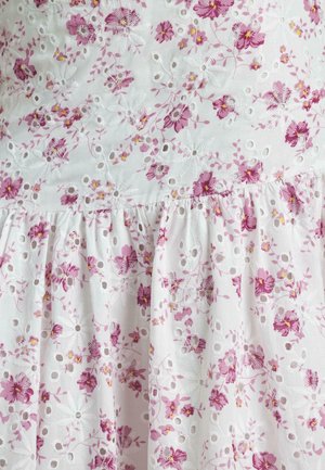 White fabric dress featuring pink floral embroidery, eyelet details, and a gathered skirt. The texture is soft, with a lightweight, airy design.
