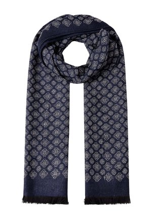 Navy blue woven scarf with repeating light gray geometric floral patterns and black fringed ends, arranged in a loop.