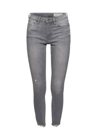 Vaqueros ajustados gris con detalles desgastados, cierre de botones, presillas para cinturón y dobladillos sin rematar. Fabricados con material de mezclilla de textura suave.