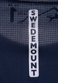 Navy textured fabric with white label reading "SWEDEMOUNT" in bold letters. Features subtle grid pattern in the material.