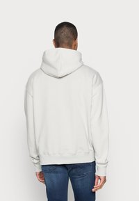 Pegador LOGO HOODIE - Camisola - cloud grey