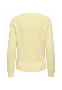 Pull en maille jaune texturé avec des manches longues, des poignets côtelés et un col rond. Matière douce de poids moyen avec un motif discret moucheté.