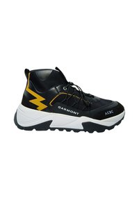 Black and yellow athletic shoe with a textured upper, white sole, and zigzag accent. Features a lace-up design and branding on the side.