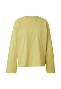 Lange mouw, crewneck shirt in lichtgeel katoen. Eenvoudig, ongecompliceerd ontwerp met een relaxte pasvorm en zachte textuur.