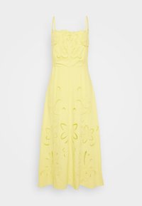 Vestido de algodón amarillo con tirantes finos; presenta patrones florales bordados y detalles recortados en toda la falda y el cuerpo.