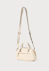 Quilted cream handbag with dual handles and an adjustable shoulder strap, featuring gold-tone hardware and a central zipper pocket.