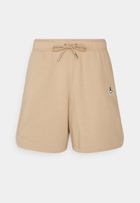 Tan bomuldsshorts med elastisk talje og justerbar snor. Har et lille sort logo på venstre side. Glat tekstur.