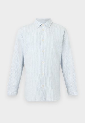 Helehall ja valge vertikaalsete triipudega pikkade varrukatega särgi, millel on krae ja nööpidega mansetid.