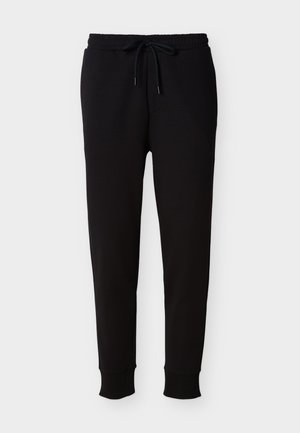 Μαύρο παντελόνι τζόγκερ από μαλακό ύφασμα, με ελαστική μέση και κορδόνι, καθώς και στενά τελειώματα στα μπατζάκια. Ομαλή υφή χωρίς σχέδια.