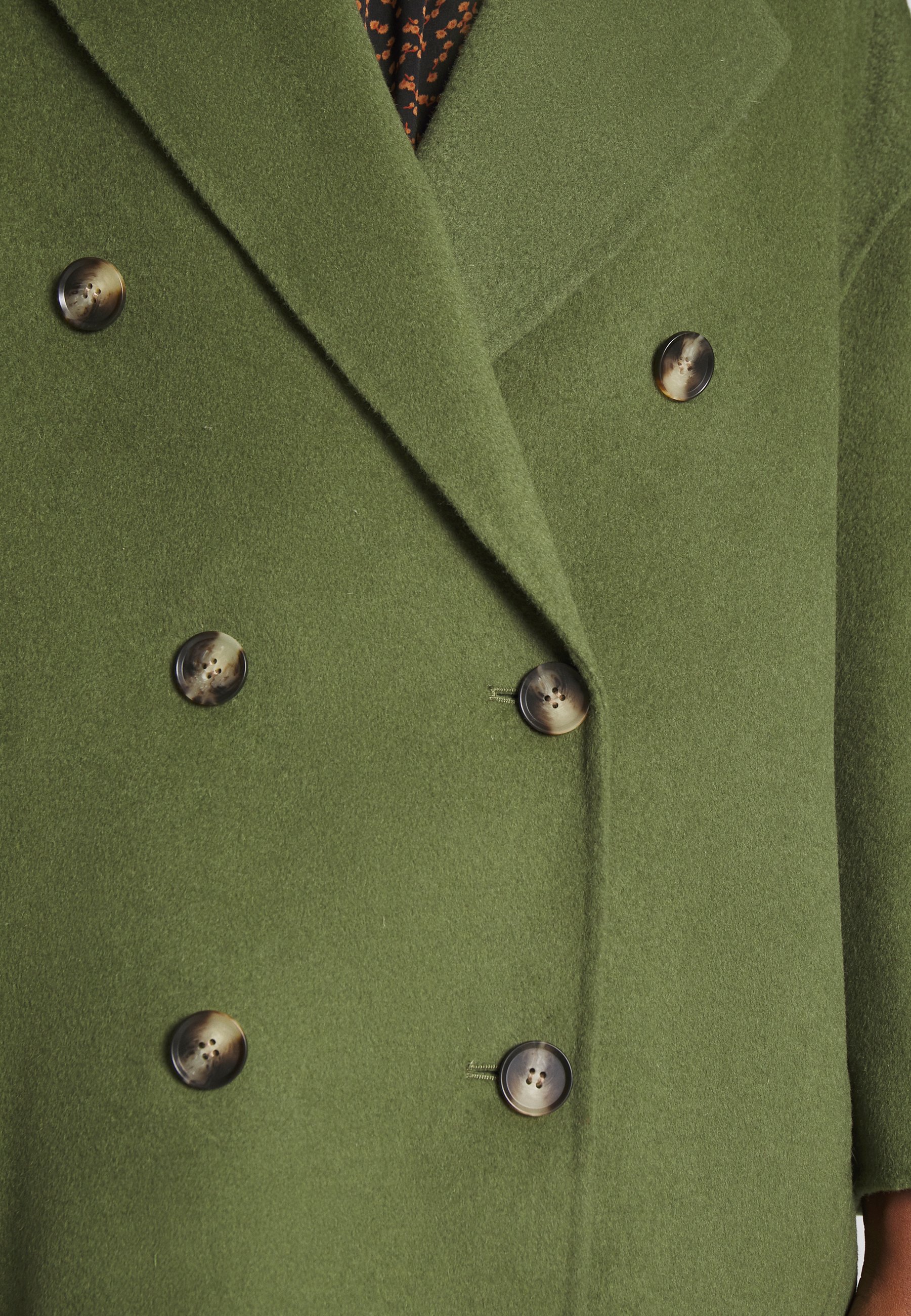 manteau vert bouteille