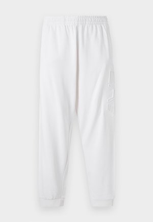 Pantalones de chándal blancos con corte ajustado, cinturilla elástica y puños en los tobillos. Cuenta con un detalle de logo texturizado en el muslo izquierdo. Material suave.
