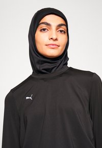 Puma MODEST ACTIVEWEAR WIDE LEG - Treniņtērpa apakšdaļas - black