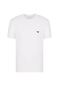 T-shirt bianco in cotone con scollatura rotonda e maniche corte. Presenta un piccolo logo nero nella zona sinistra del petto. Texture liscia.