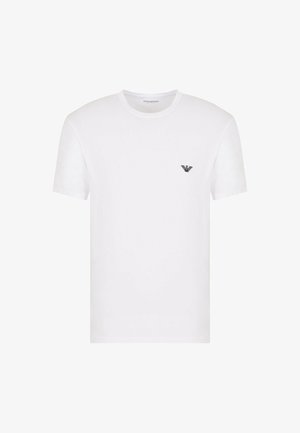 T-shirt bianco in cotone con scollatura rotonda e maniche corte. Presenta un piccolo logo nero nella zona sinistra del petto. Texture liscia.