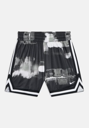 Shorts atletici a motivi in bianco e nero con vita elasticizzata, strisce laterali, rifinitura a chevron sull'orlo e piccolo logo Nike sulla gamba destra.
