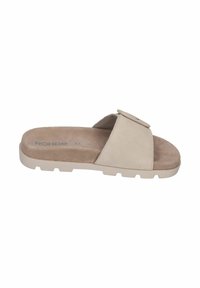 Beige suede slide sandal with a wide strap featuring a decorative button, cushioned insole, and textured rubber sole with a slight heel.