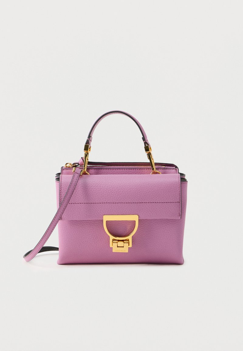 Purple leather handbag with a structured design, featuring a gold-tone hardware clasp and a detachable shoulder strap. Smooth texture.