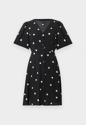 Svart kortermet kjole med hvite polkadotter, V-hals, knappelukking foran og lett utsvingt skjørt.