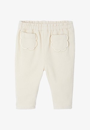 Cremefarbene gerippte Babypants mit elastischem Bund und gewellten aufgesetzten Taschen auf der Rückseite.