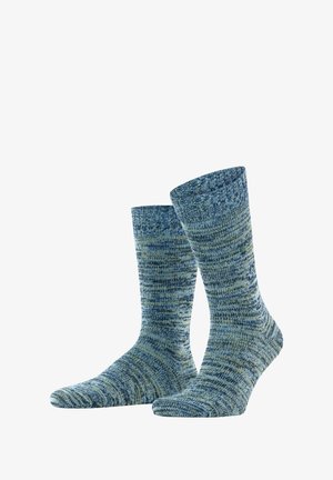 Chaussettes tricotées en bleu et vert marbré avec une bordure côtelée, de longueur mi-mollet, texture lisse et un détail d'accent circulaire subtil.
