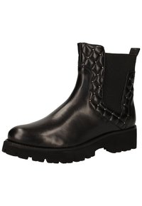 Bottines en cuir noir avec une semelle épaisse, des panneaux latéraux matelassés, des élastiques d'aisance, et des clous décoratifs sur le dessus pour le détail.