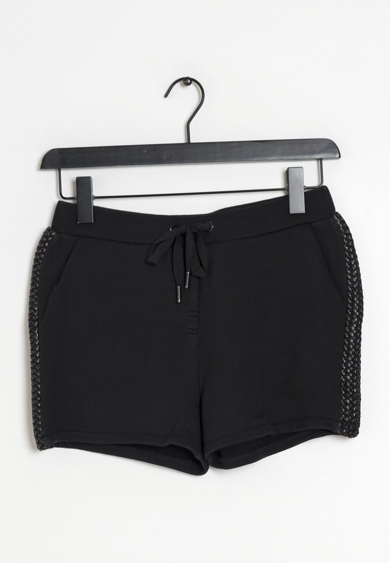 Pantaloni pantaloni neri realizzati in un tessuto morbido, caratterizzati da una vita con cordoncino e dettagli decorativi intrecciati sui lati. Texture liscia, design informale.