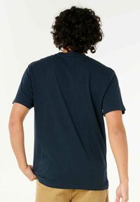 Navy blue short-sleeve T-shirt made of cotton blend; features a crew neck and relaxed fit, with a smooth texture and no visible graphics.