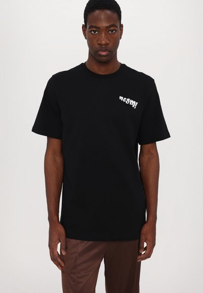 Black cotton t-shirt featuring a crew neckline and short sleeves. Decorative white text on the chest adds detail. Simple and clean design.