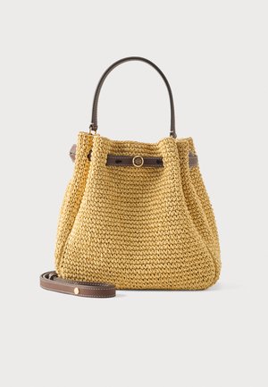 Yellow woven handbag with brown leather handle and detachable shoulder strap, featuring a round gold logo button.