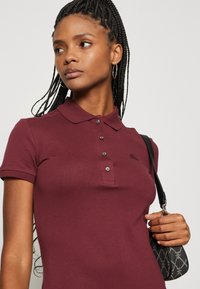 Lacoste Haljina od žerseja - zin