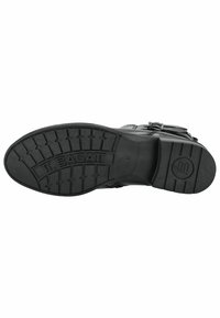 Suela de bota de goma negra con un patrón de relieve, marca en relieve y un diseño de bajo perfil para tracción y durabilidad.