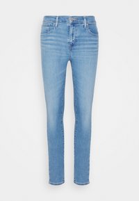 Ljusblå denimjeans med slim-fit design, som har fem fickor, knappstängning och subtila blekningar. Tillverkade av stretchig bomullsmaterial.