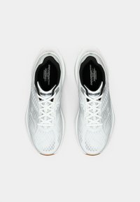 Pair of white Saucony Endorphin Speedroll running shoes with mesh uppers and white laces viewed from above on a white background.